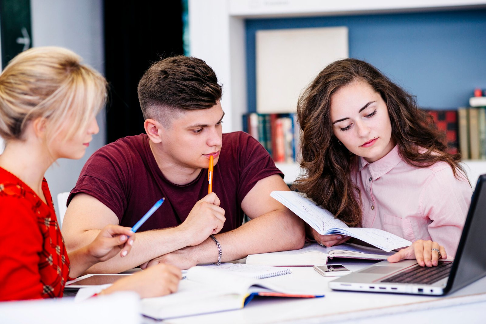 young people studying using laptop